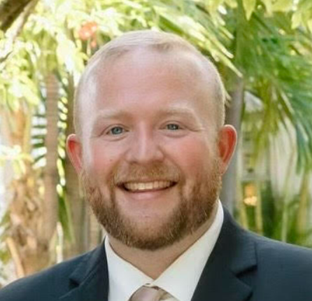 Man in suit smiling at camera