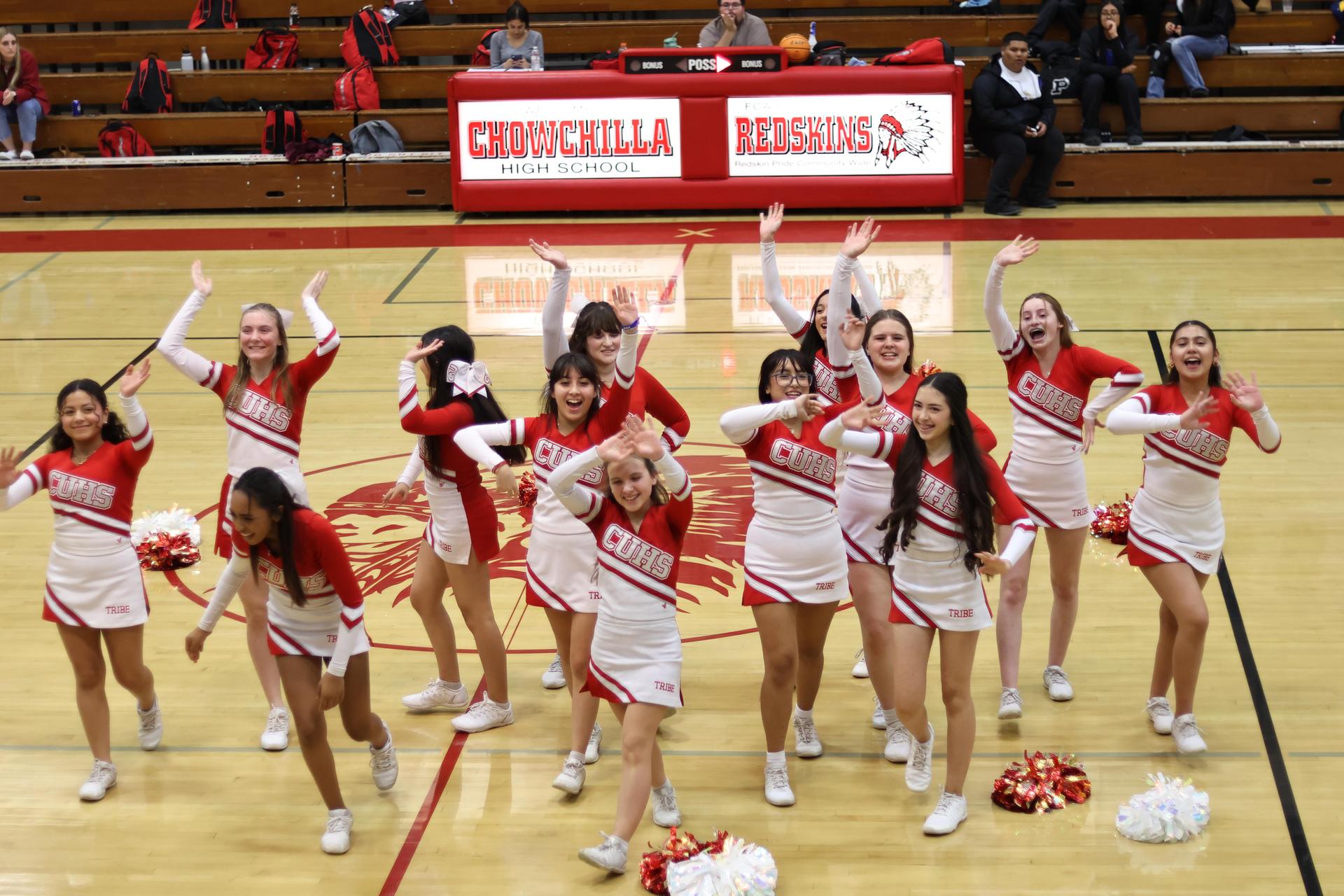 junior varsity cheerleaders cheering