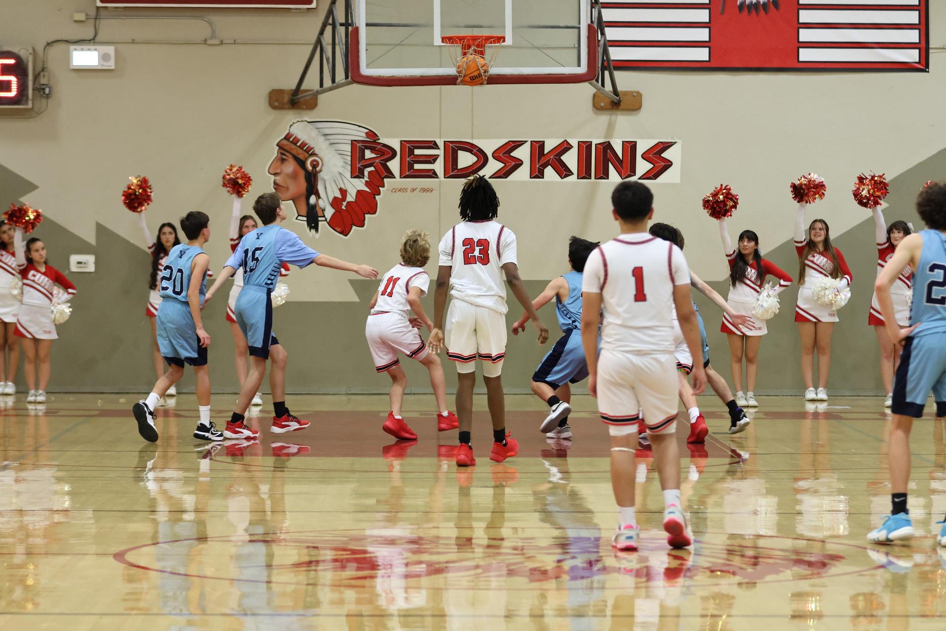 junior varsity boys playing basketball against yosemite