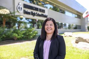 Photo of Traci Green in front of HBUHSD office