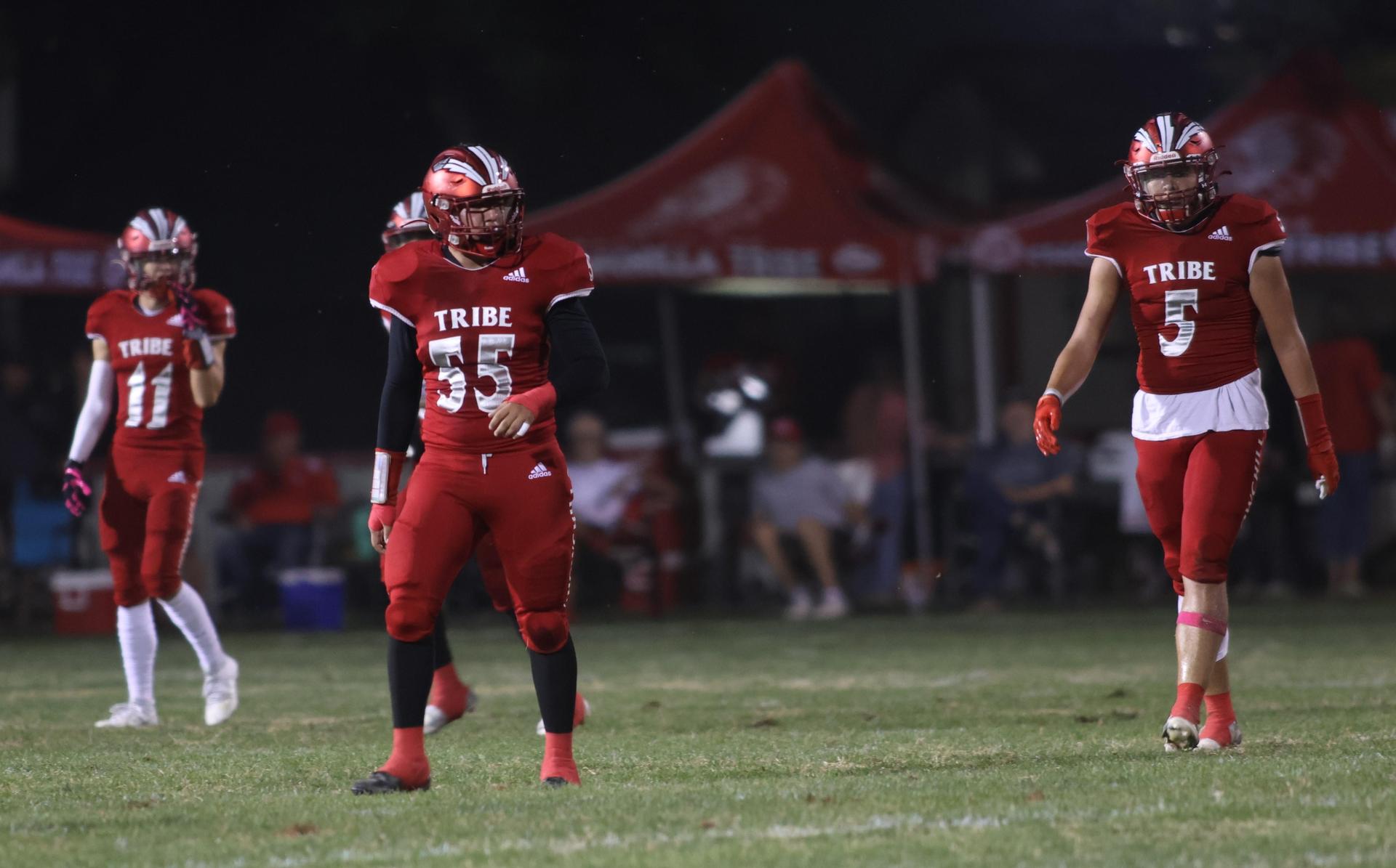 varsity boys playing football against Fowler