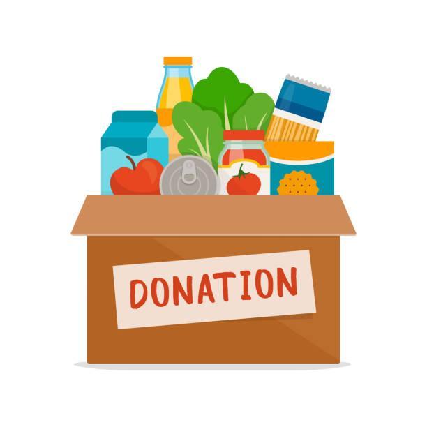 Cardboard donation box filled with various food items like fruits and vegetables.