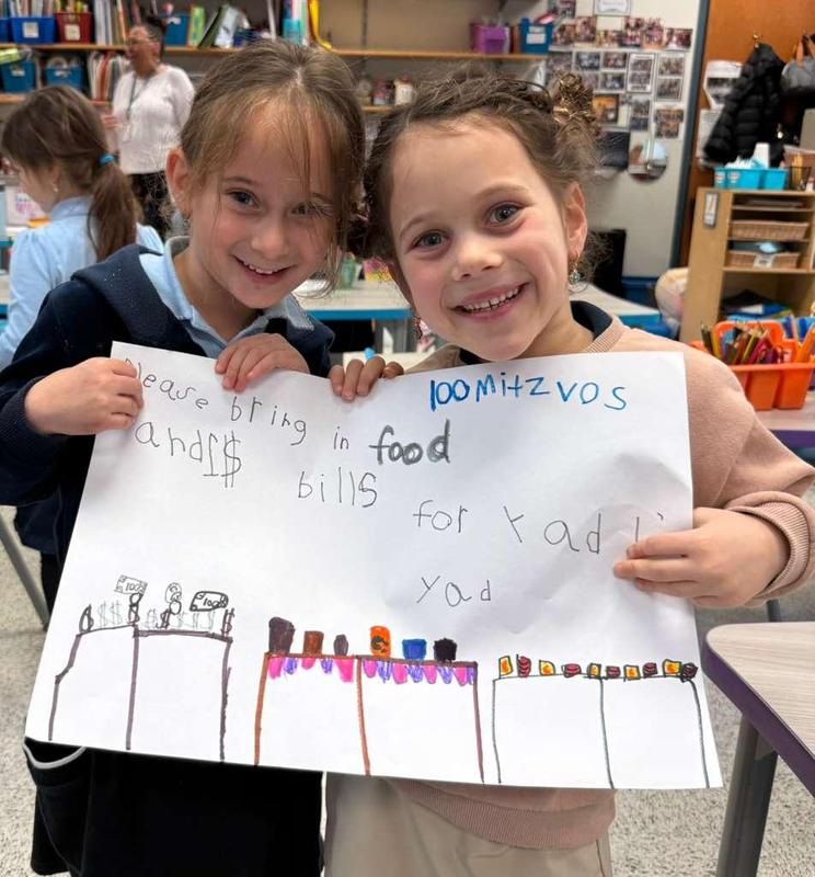 Kindergarteners show off their poster