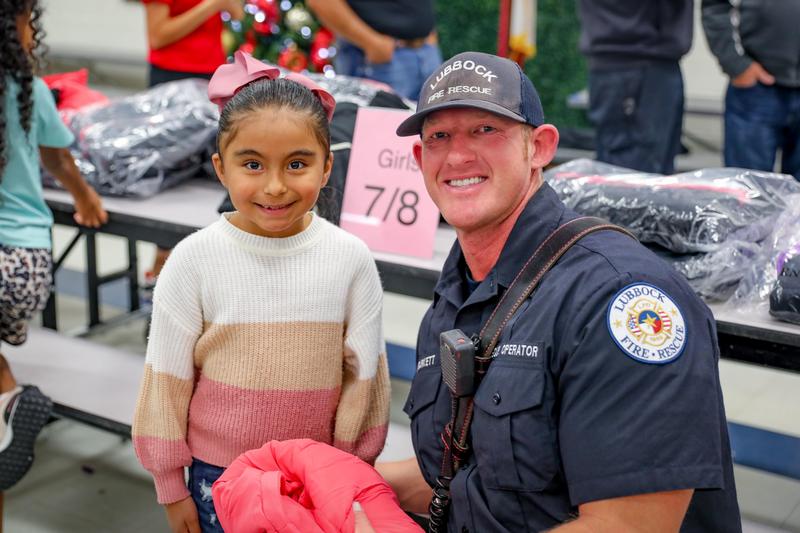 westwind student smiling with lubbock firefighter