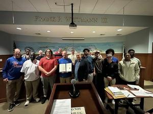 Tonight, the Pirates were shining at the City of Pass Christian Board of Aldermen’s meeting.  The Pledge of Allegiance was led by Eloise Newman, and the City signed a proclamation to commemorate our historic football season.