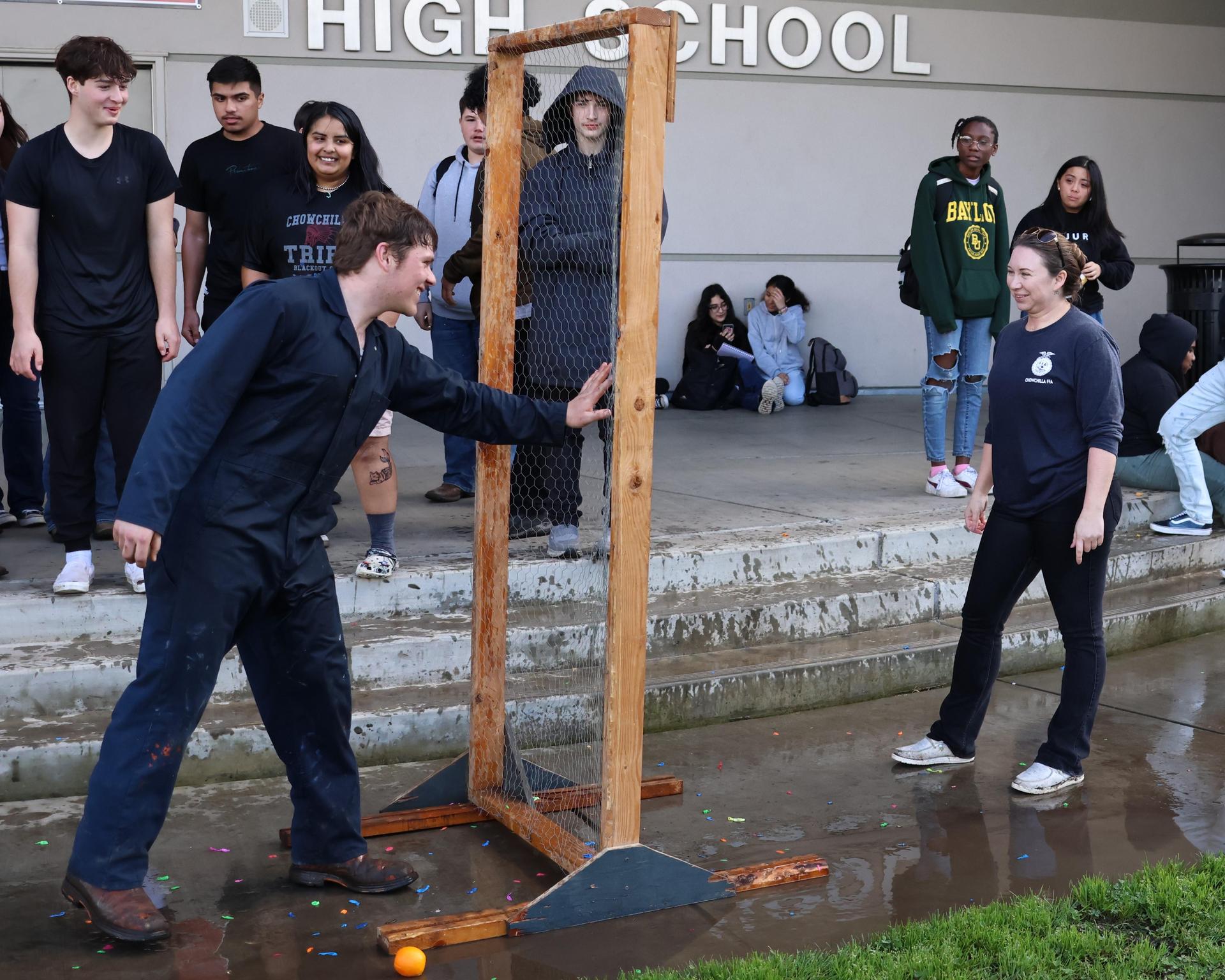 students and staff enjoying the water balloon toss