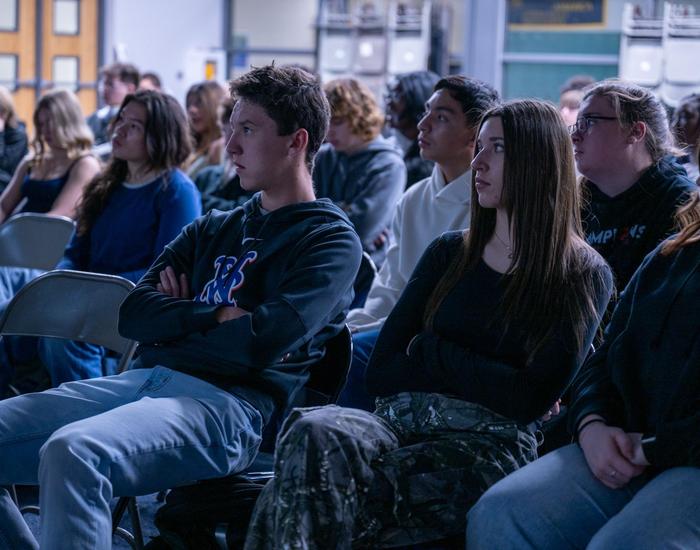 students look at slide