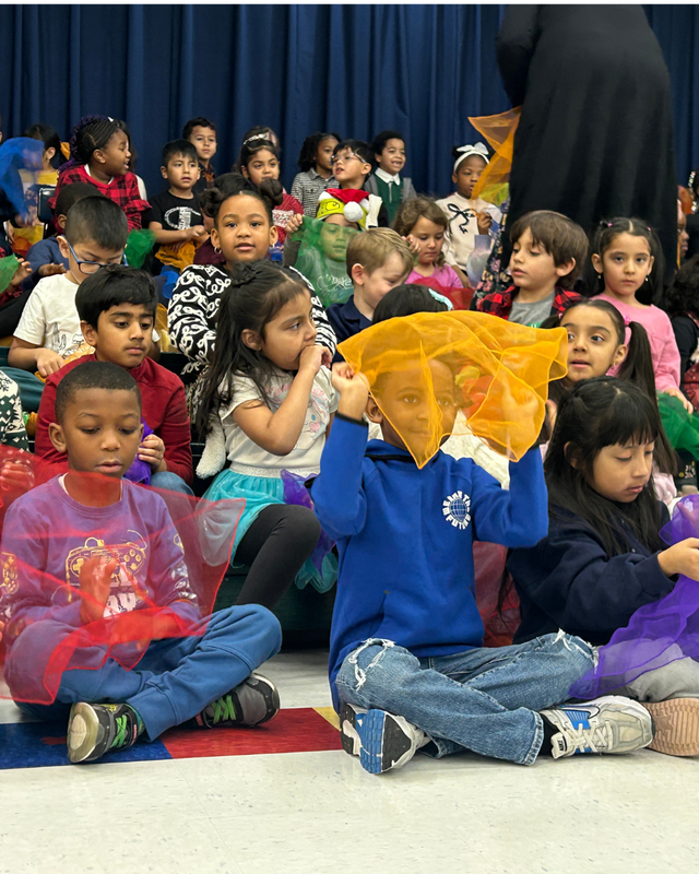 Students play with props at assembly