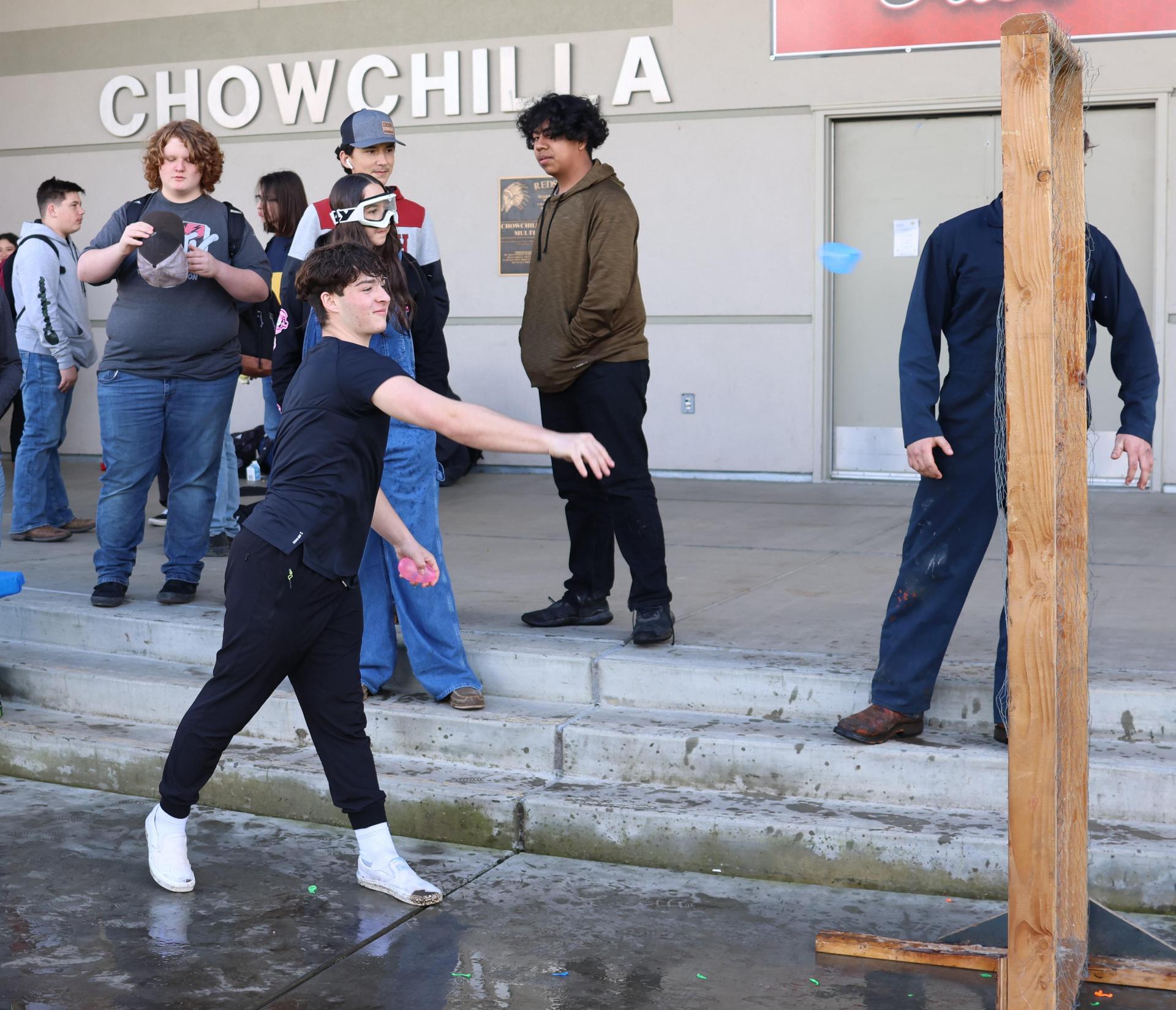 students and staff enjoying the water balloon toss