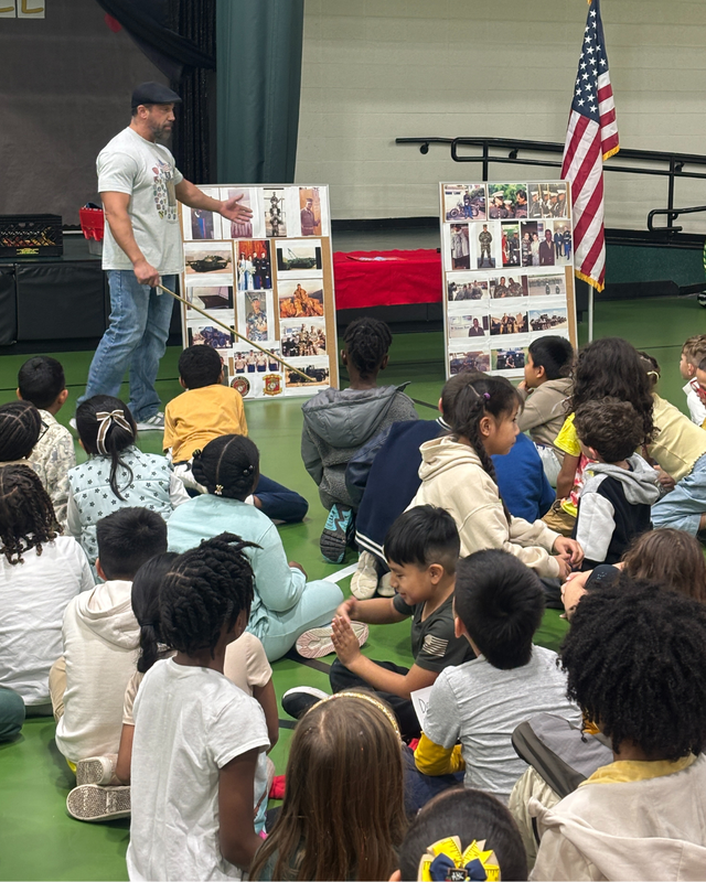 Mr. Pellino shows photos to students