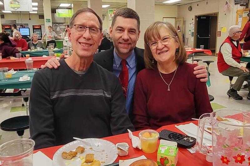 Band Director Mr. Brandon Pyles pictured with Don and Diane Sargent