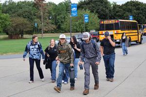 Freshmen coming off the bus in the morning