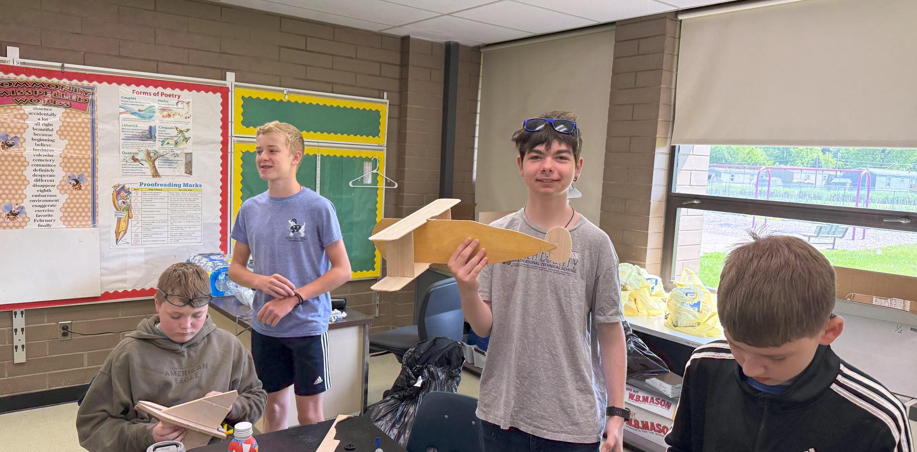 students building wooden gliders