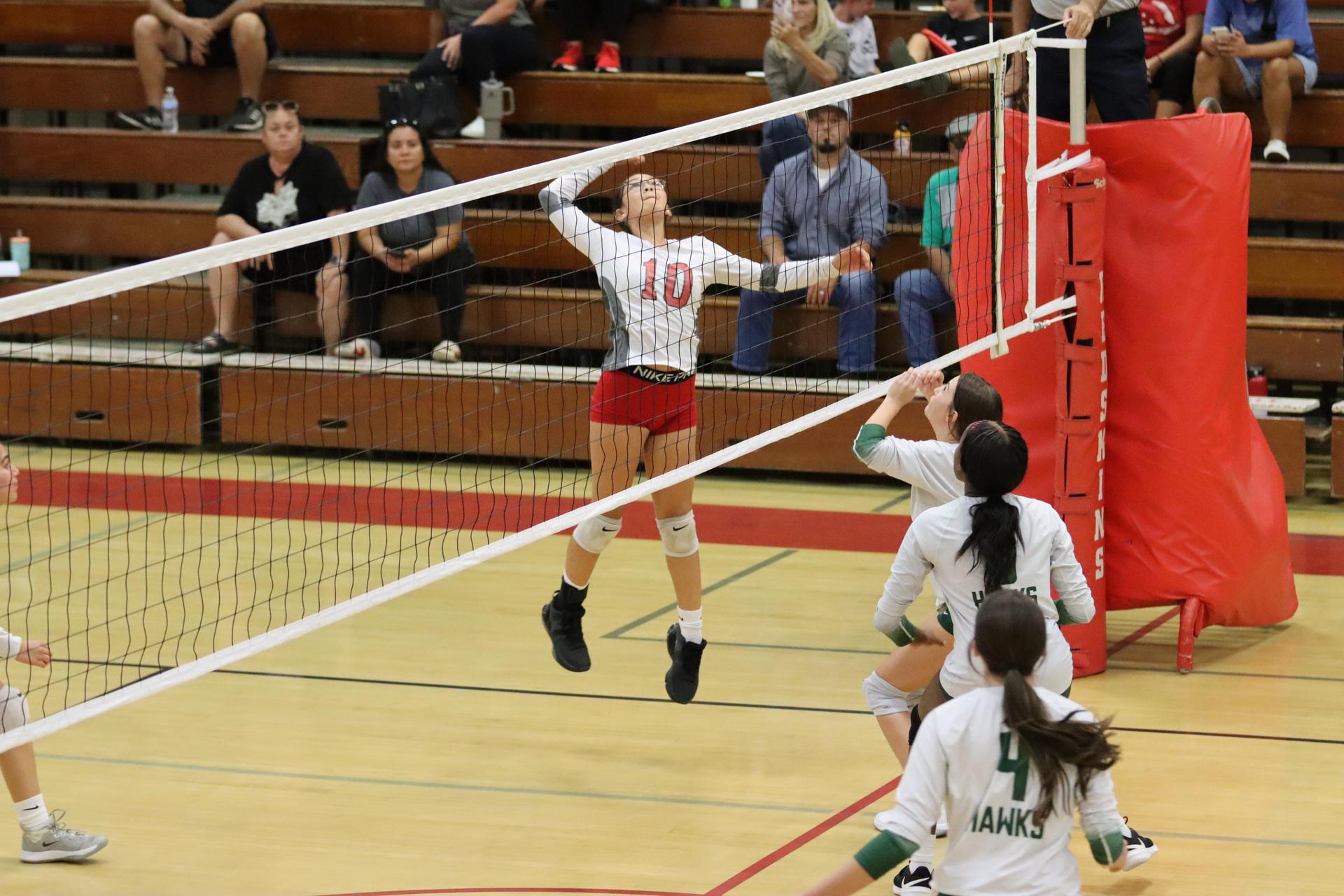 junior varsity girls playing volleyball against Liberty
