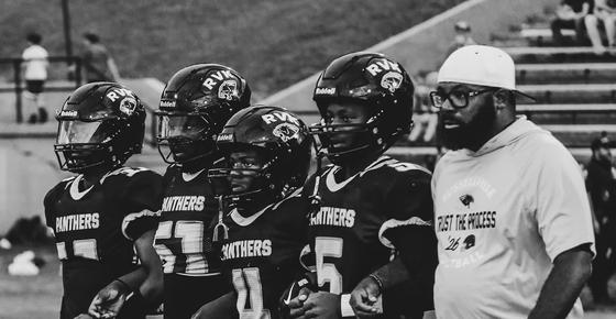 Coach Griffin with football players