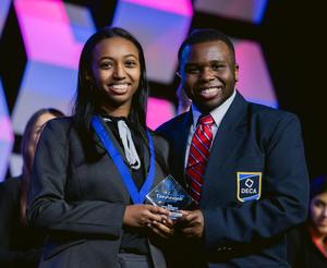 Smiling group of students, some with awards