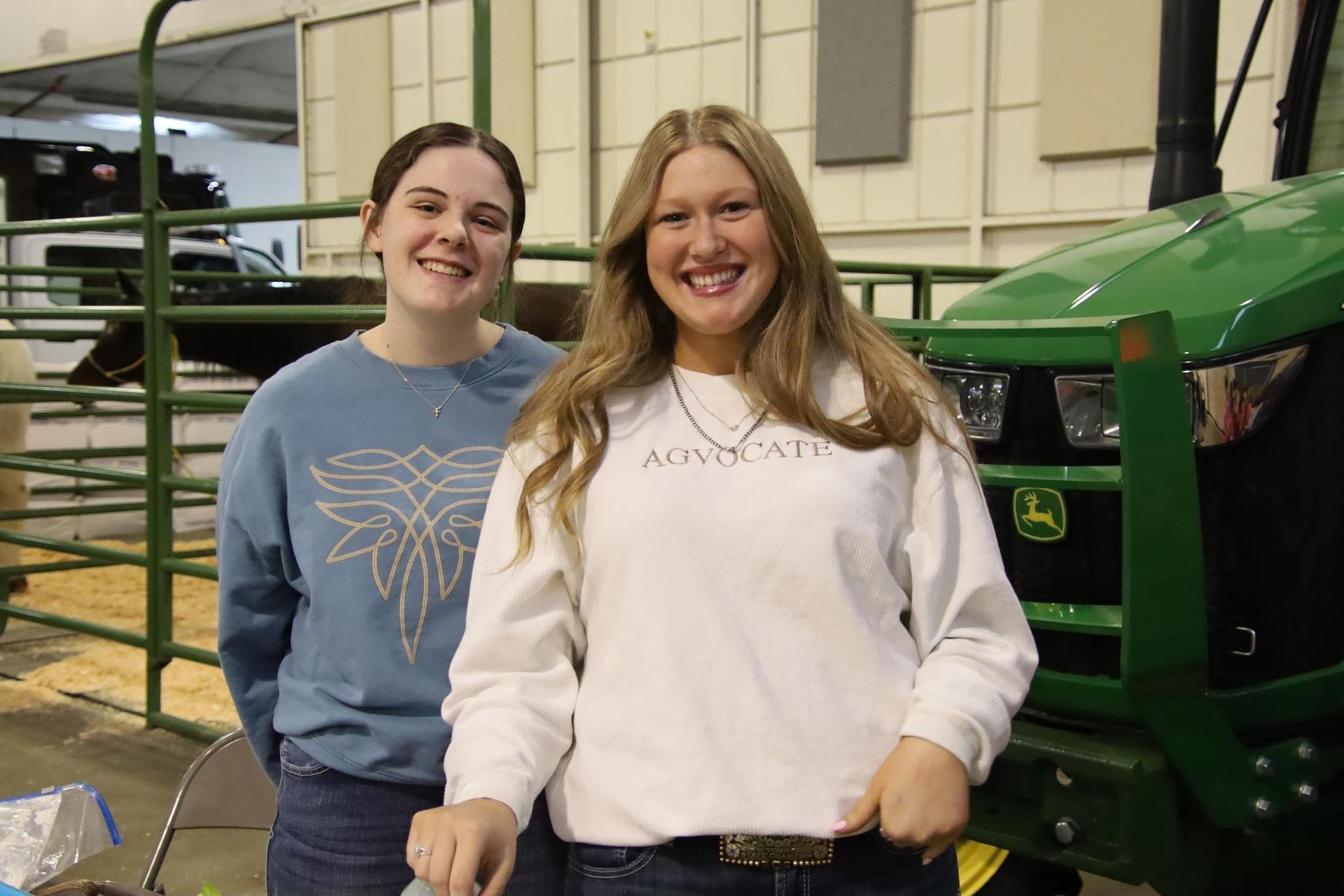 Two students smiling at the Ag Expo