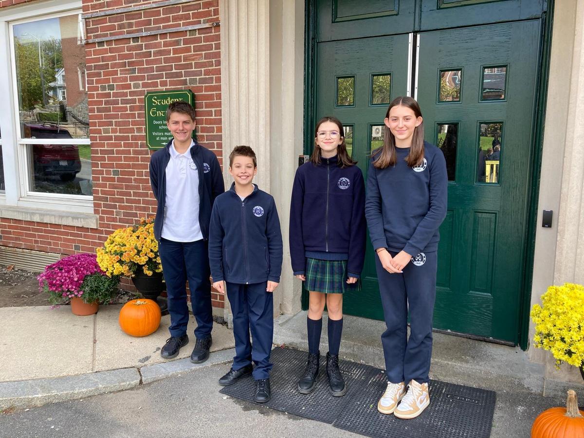 Students standing at the door of Saint Peter School