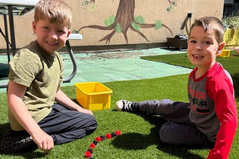 Conor Mullen and Joey Maholage build an alternating black and red pattern with their blocks