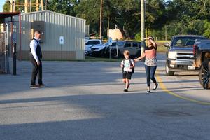 Mr. Everett welcoming kids on the first day of school.
