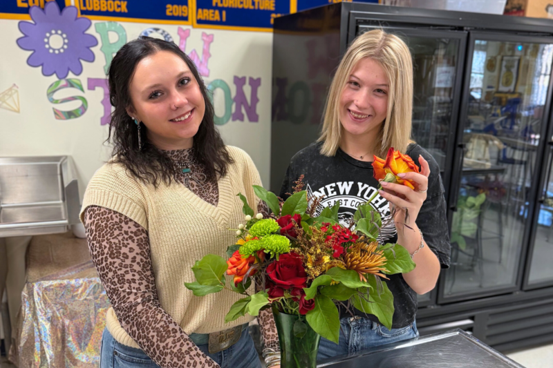 Allison Wimberley and Natalie Hill with floral design arrangement