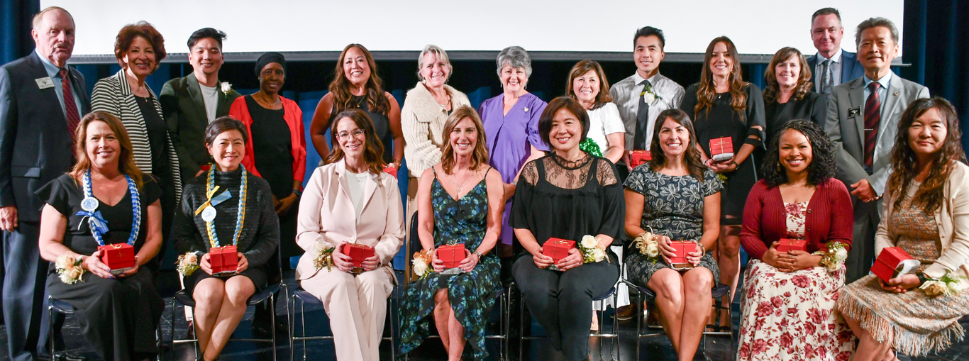 2024/2025 Teachers of the Year Recipients take a photo with the Board of Trustees.