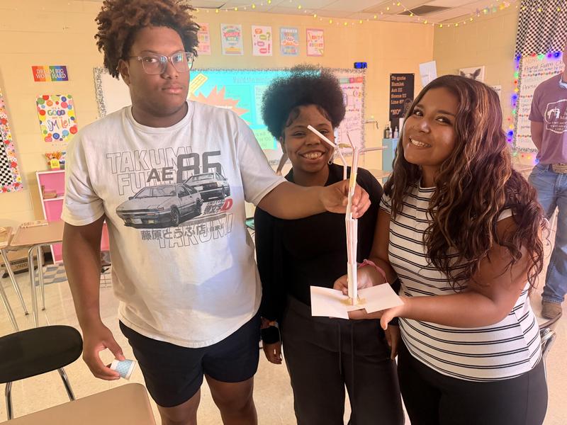 Three students showcase their windmill
