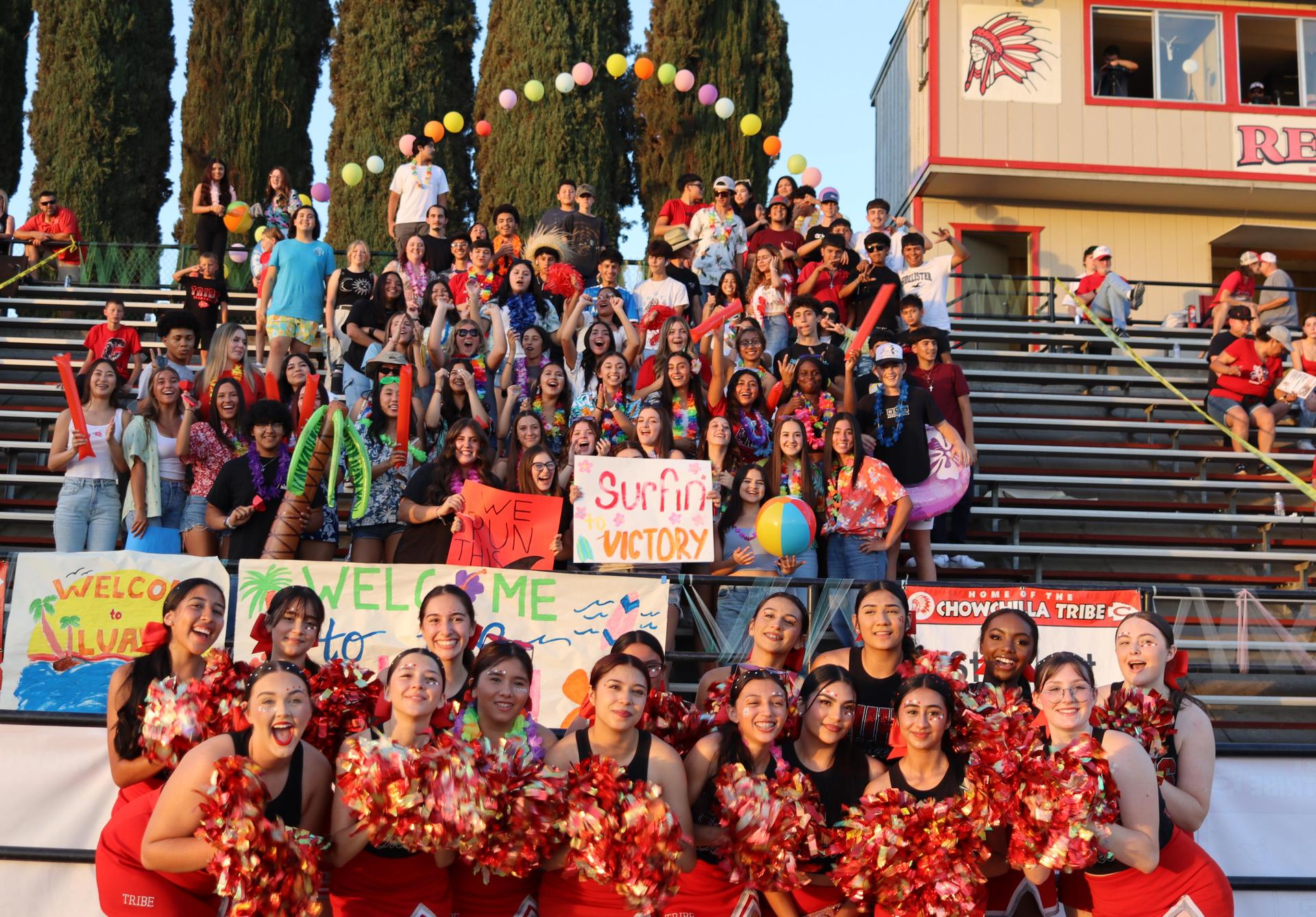 Varsity girls cheering at the Parlier football game
