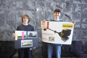 Two students show their state MITES project awards.