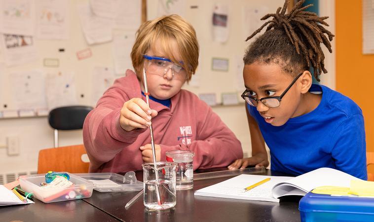Two children conducting a science experiment