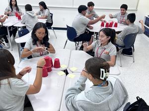 students doing the cup challenge