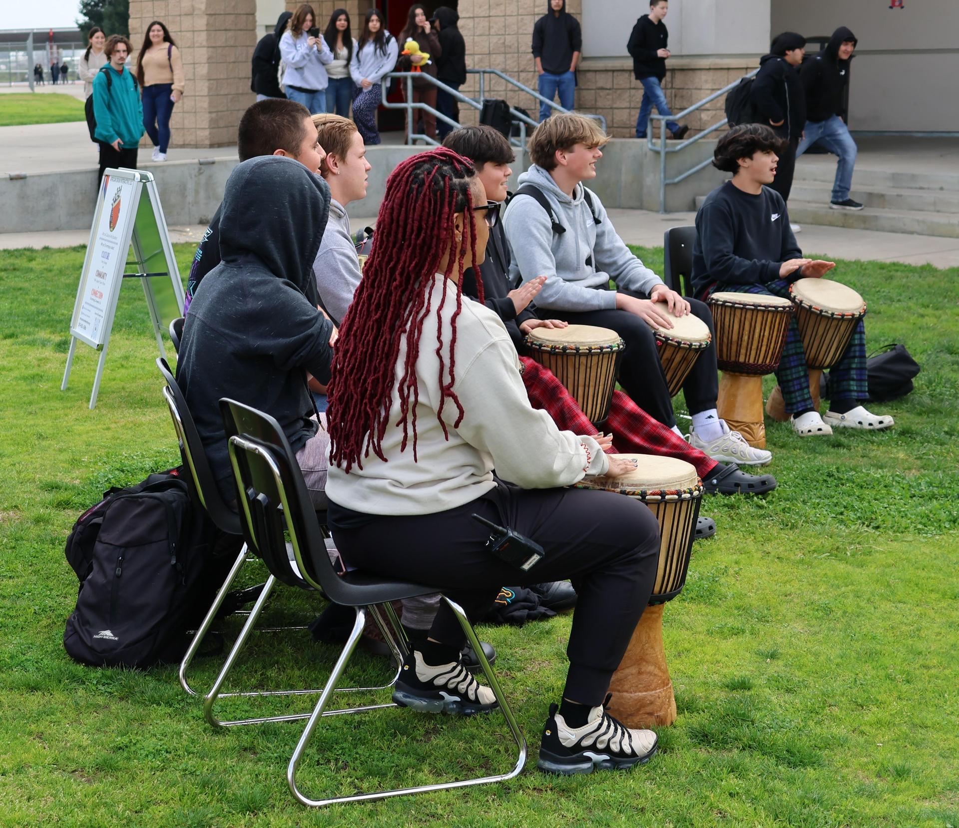students and staff participating with the African Drum Interactive