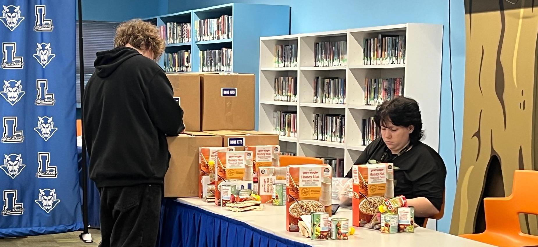 Students work to organize a generous donation facilitated by the United Way with funding from Duquesne Light Co., and in kind donations from Giant Eagle.