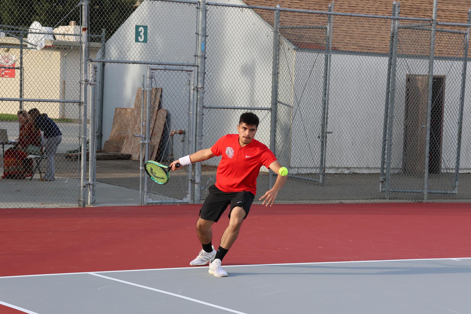 CUHS Boys playing tennis against coalinga