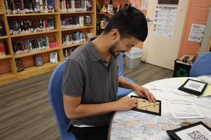 Holloway students frame QR codes for a school project