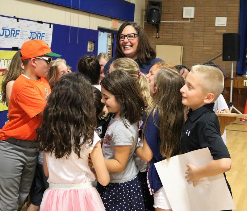 Photo of Jefferson 4th graders surround their teacher, Anna Carissimo, as she is honored at May 7 Board of Education meeting as the recipient of the 2019 Charles Philhower Fellowship Award which recognizes outstanding elementary school teachers