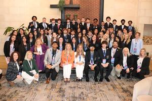 Smiling group of students, some with awards