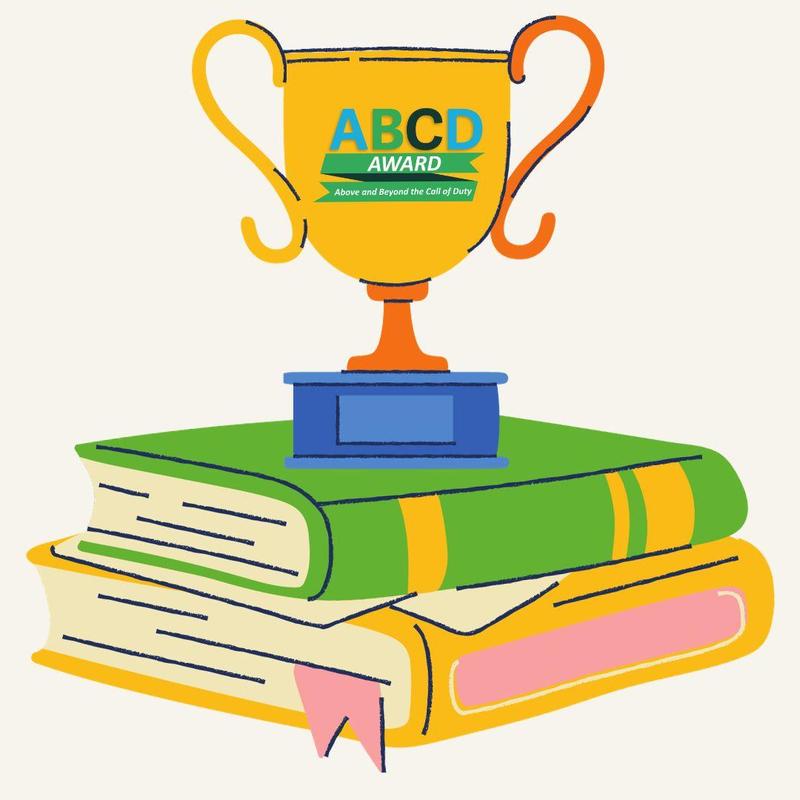 Trophy placed on top of a stack of books.