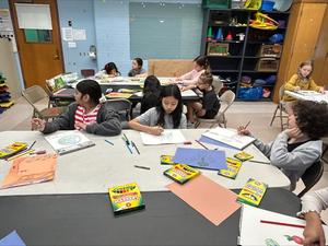 students sitting and drawing