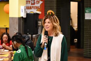 Staff member speaking into microphone