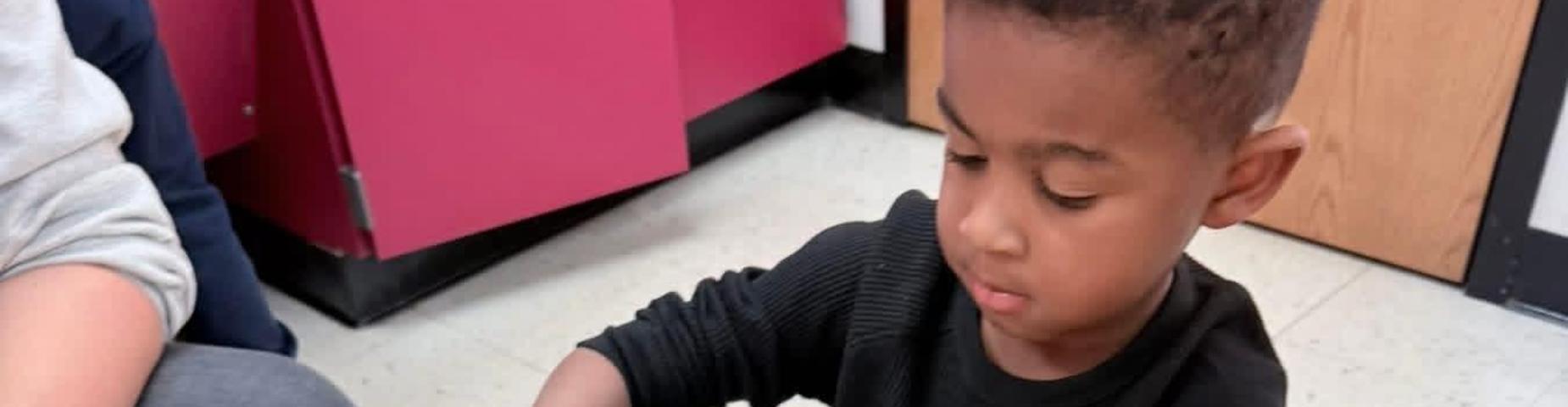 A young student working on crafts