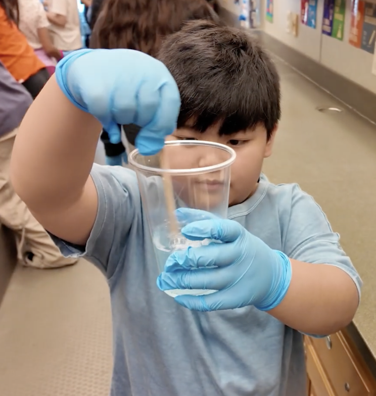 Science student mixes chemicals