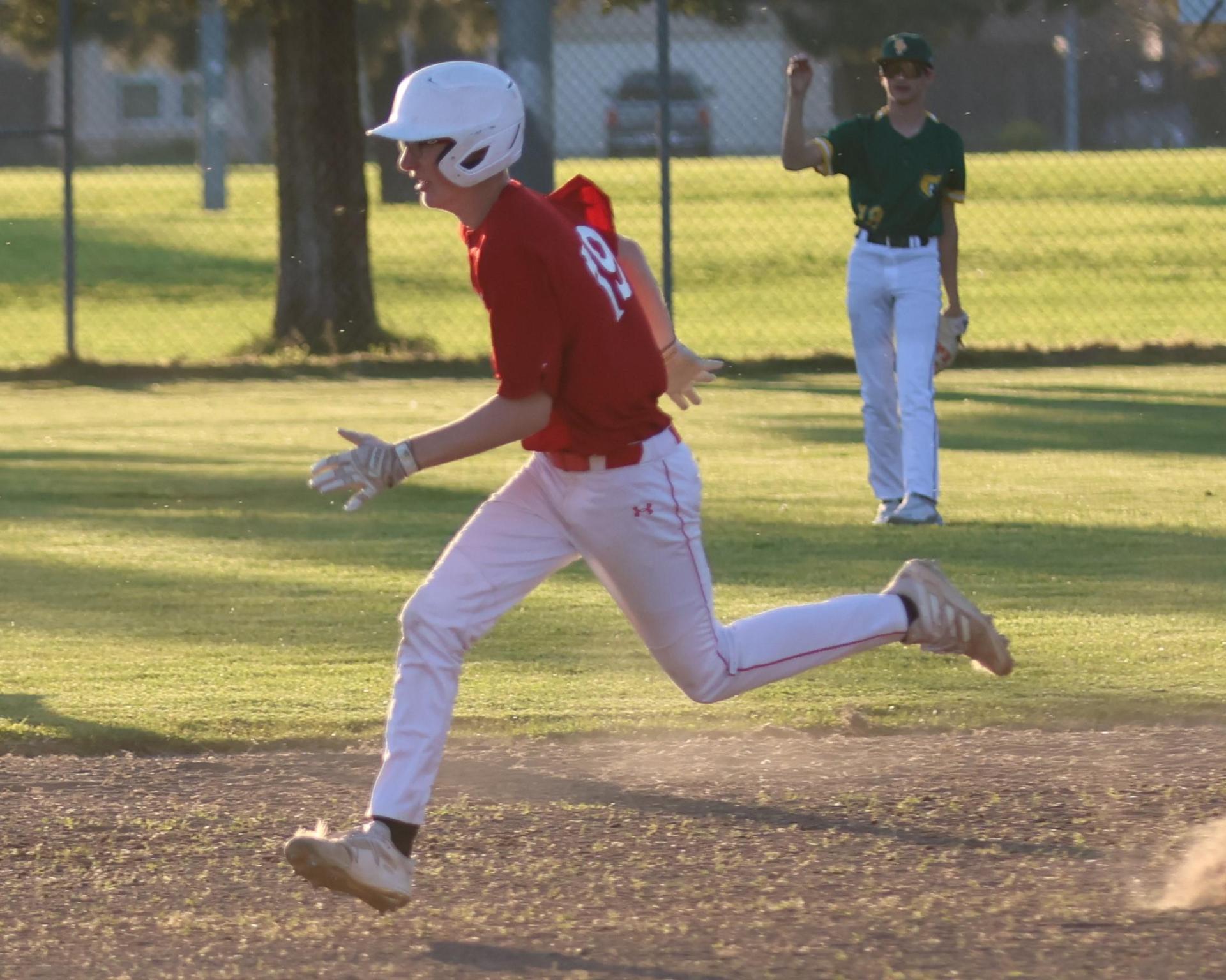 junior varsity baseball players in action