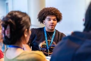 A student listens to a peer