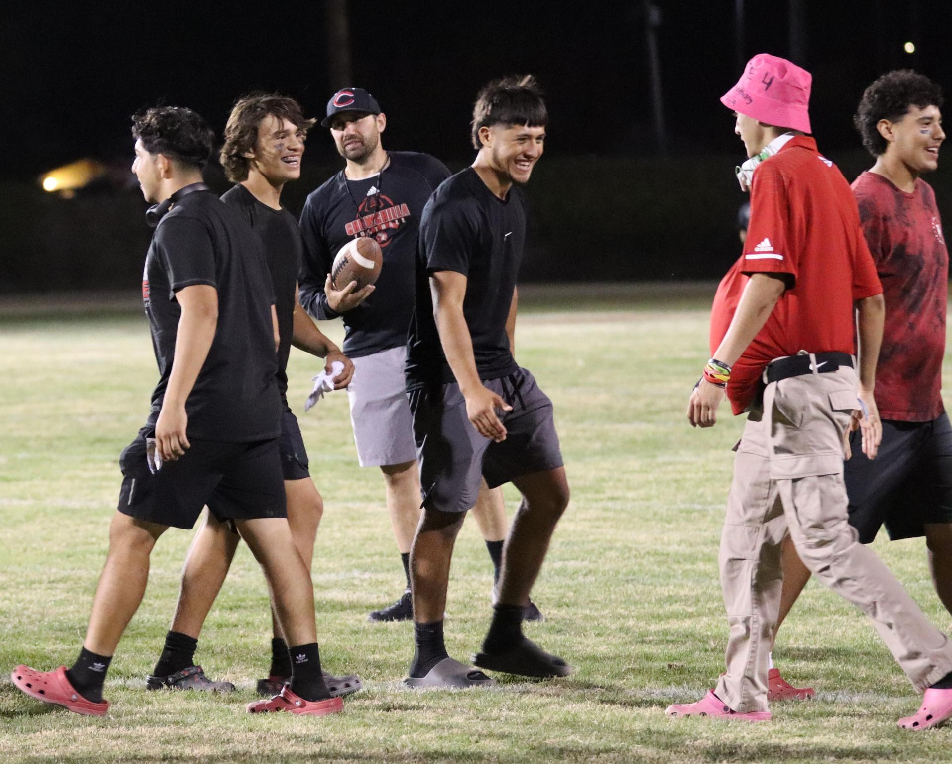 students shaking hands after the game