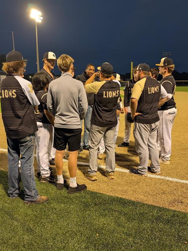 Coaches having a speech with the team.