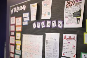 bulletin board inside HCIS 7-12 public charter advertising student clubs and events
