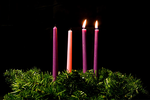 advent wreath with 2 purple candles lit