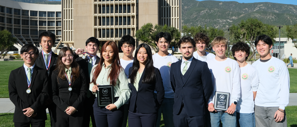 Students smiling at a competition