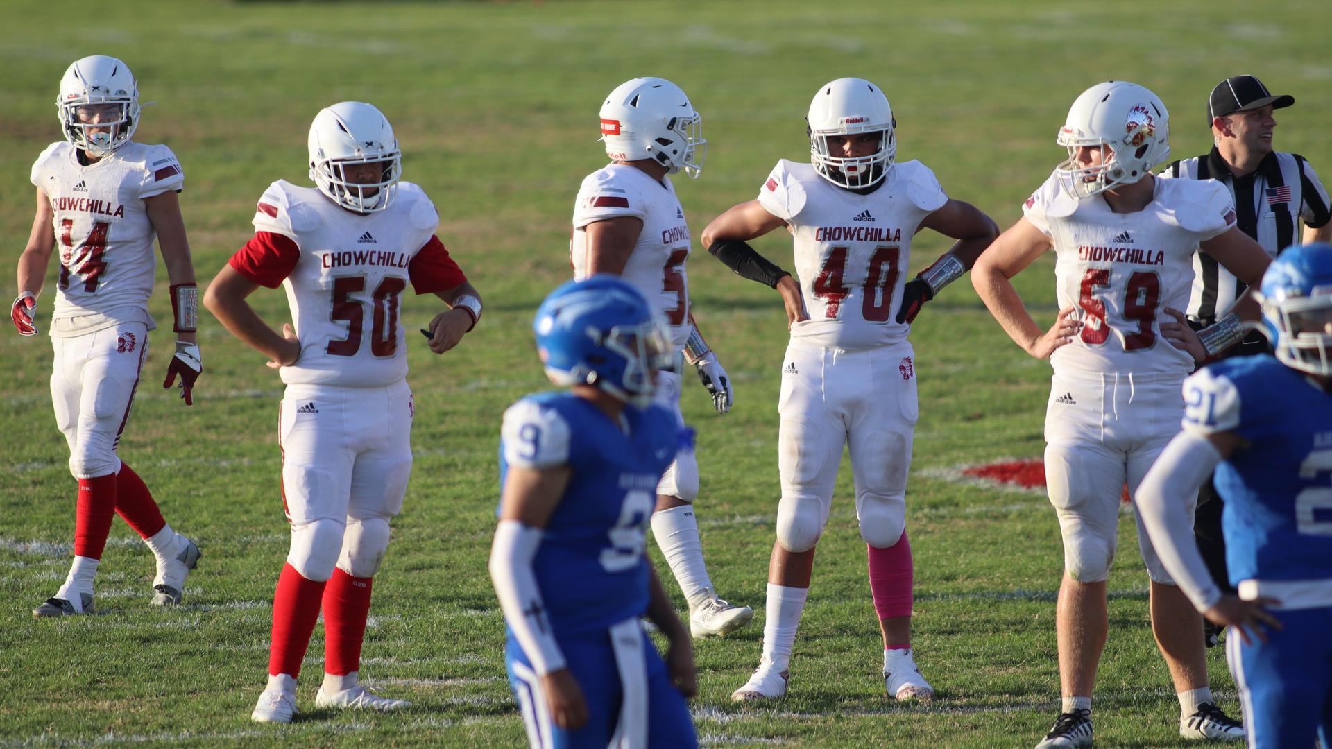 Junior Varsity football players in action against Caruthers